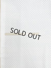 生地：ポリエステル100％水玉柄プリント（白／黒）