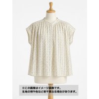 生地：ポリエステル100%幾何学プリントバックサテンアムンゼン（白地／黄・グレー）